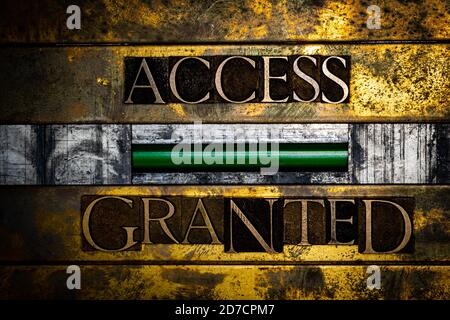 Acces Granted text message with green confirmation sign on vintage textured grunge copper and gold background Stock Photo