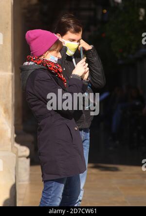 Cracow. Krakow. Poland. Second wave of coronavirus pandemic. Restrictions are back. Young couple wearing masks. Stock Photo