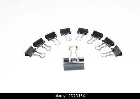 Black Paper clips, isolated on white background. Stock Photo