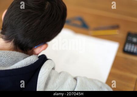 Year 9 aged 13 Child home learning doing KS3 Maths assessment at home during Covid-19 lock down, UK, October 2020 Stock Photo