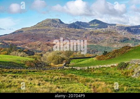 Moelwyn Bach left and Moelwyn Mawr right  looking west from near Llan Festiniog showing the Stwlan Dam set in the mountainside North Wales  UK October Stock Photo