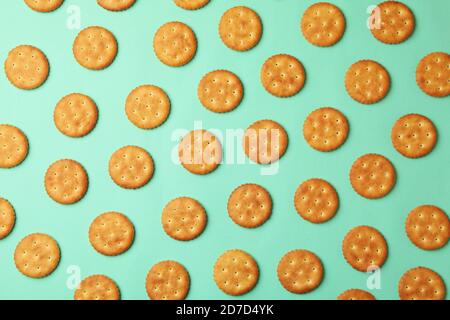 Flat lay with cracker biscuits on mint background Stock Photo