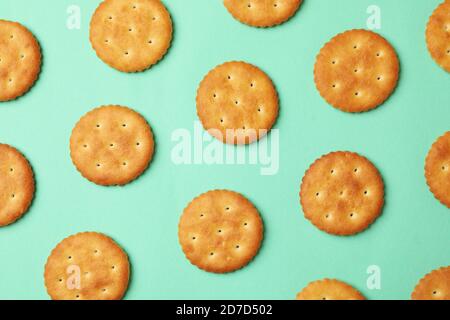 Flat lay with cracker biscuits on mint background Stock Photo