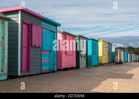 Colourful beach huts closed up for winter at St Helens, Isle of Wight Stock Photo