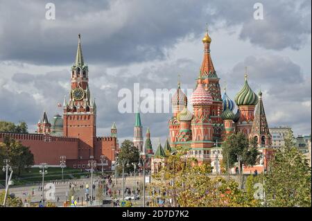 = Spasskaya Tower and St. Basil’s Cathedral in Autumn Season =  Beautiful cityscape with the view from Zaryadye park on the most famous Moscow landmar Stock Photo