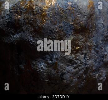 Dark blue sedimentary hypertufa rock with glittering golden spots Stock Photo
