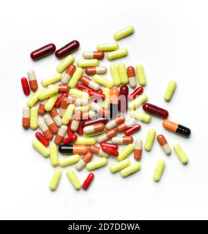 Top view of pile of colorful pills against white background. Stock Photo