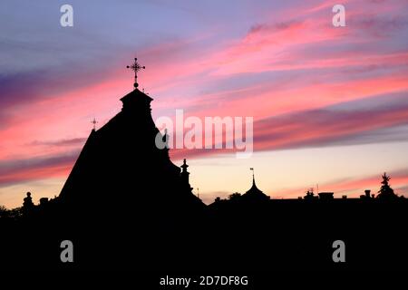 Night cityscape with church at Swietoduska street in Lublin and colorful sky at dusk Stock Photo