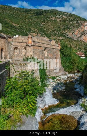 The ramparts of the medieval village of Villefranche-de-Conflent, in the Occitanie region of southern France. Fort Liberia is in the background. Stock Photo