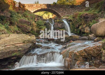 Three Shire Heads. A waterfall and packhorse stone bridge at Three Shires Head in the Peak District National Park. Stock Photo