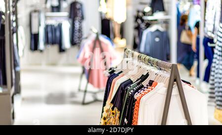 Woman clothing on hanger at the modern shop boutique Stock Photo