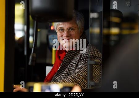 21 October 2020, Berlin: Eva Kreienkamp, chairwoman of the board of Berliner Verkehrsbetriebe, is at the wheel of the new BVG double-decker. Bus of the type 'Alexander Dennis Enviro500' is parked at the BVG bus depot Müllerstraße. The Berliner Verkehrsbetriebe are presenting two new BVG double-deckers. The bus has room for 112 passengers, is 2.55 metres wide and 4.06 metres high. From mid-November, the vehicles are scheduled to run on Line 100. Photo: Kira Hofmann/dpa-Zentralbild/ZB Stock Photo