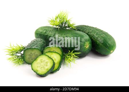 Cucumbers and greens on white isolated background Stock Photo