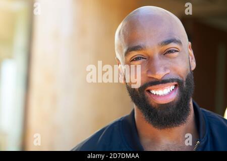 Portrait Of Smiling African American Man Outdoors In Garden At Home Stock Photo