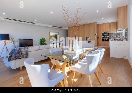 Dining table in a modern living room interior design Stock Photo