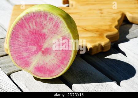 Green and pink watermelon radish cut in half Stock Photo