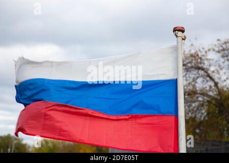 The Russian flag, growing in the wind. Flag of the Russian Federation Stock Photo