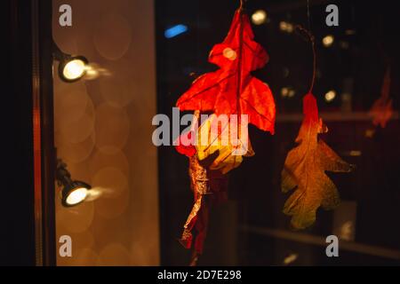 Artificial autumn leaves on the showcase Stock Photo