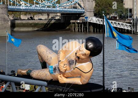 London, UK. 22nd Oct, 2020. a Giant Inflatable Borat is seen on a barge on the River Thames by Tower Bridge at City of London, London, England on 22 October 2020. Photo by Vince Mignott. Credit: PRiME Media Images/Alamy Live News Stock Photo