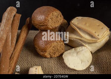 Closeup shot of bakery products on a sackcloth Stock Photo