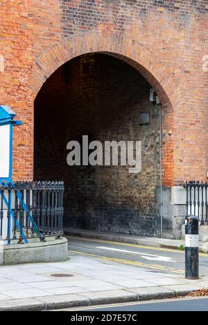 Dark alley, arched lane way,between old red brick buildings in Dublin street. Ireland Stock Photo
