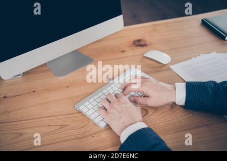 Cropped view portrait of his he professional experienced man ceo boss chief director typing on key board letter e-mail report research market sales on Stock Photo