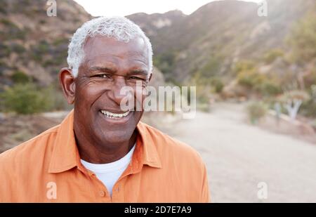 Portrait Of Smiling African American Senior Man Outdoors In Countryside Stock Photo