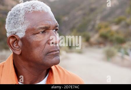 Outdoor Portrait Of Serious African American Senior Man With Mental Health Concerns Stock Photo