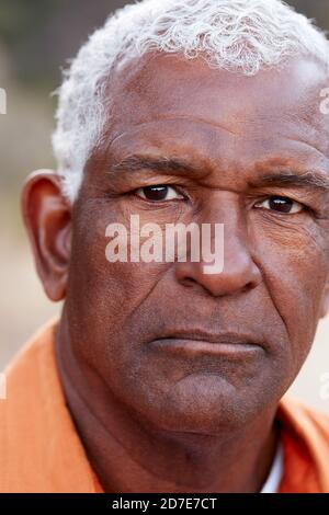 Outdoor Portrait Of Serious African American Senior Man With Mental Health Concerns Stock Photo