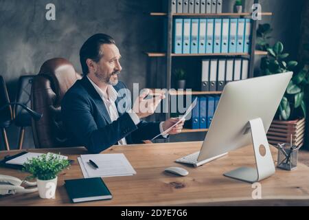 Profile side view portrait of his he nice handsome man qualified financier attending online meeting discussing it project start-up corporate law Stock Photo