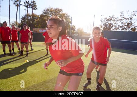 Womens Football Team Training For Soccer Match On Outdoor Astro Turf Pitch Stock Photo