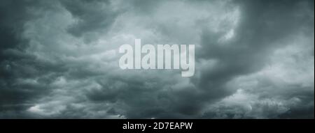 Black and white background of dark stormy clouds in gray moody sky Stock Photo