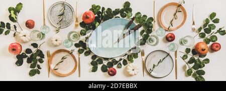 Thanksgiving holiday celebration dinner table setting decorated with fruits, pumpkins Stock Photo