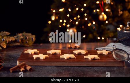 Freshly Baked Star Shaped Christmas Cookies On Board Ready For Decoration Stock Photo