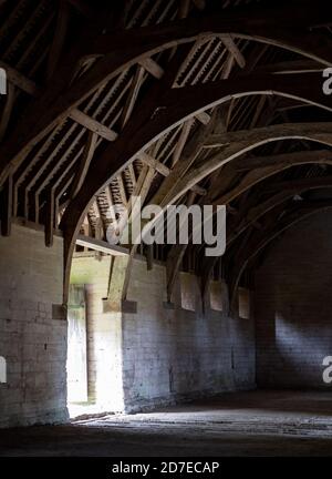 The Tithe Barn on Pound Lane, medieval stone barn in the Barton Grange complex on the River Avon in Bradford on Avon in the Cotwolds, Wiltshire, UK Stock Photo