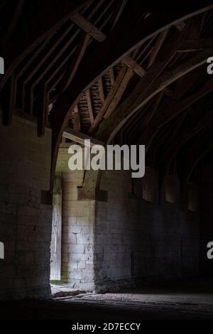 The Tithe Barn on Pound Lane, medieval stone barn in the Barton Grange complex on the River Avon in Bradford on Avon in the Cotwolds, Wiltshire, UK Stock Photo