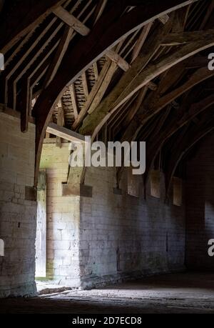 The Tithe Barn on Pound Lane, medieval stone barn in the Barton Grange complex on the River Avon in Bradford on Avon in the Cotwolds, Wiltshire, UK Stock Photo