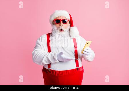 Portrait of his he nice attractive amazed stunned bearded fat guy Santa using gadget browsing post social network blog comment feedback reaction Stock Photo