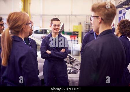 Group Of Students Studying For Auto Mechanic Apprenticeship At College Stock Photo
