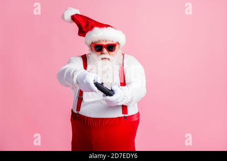 Portrait of his he nice funny focused bearded fat guy Santa father using gadget playing game station contest network battle competition air blow wind Stock Photo