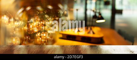 top of brown wood table with blur light lamp party in bar or pub banner background Stock Photo