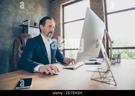 Profile side view portrait of his he nice handsome focused skilled man expert it programmer writing e-mail creating marketing plan presentation modern Stock Photo