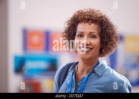 Portrait Of Mature Female Teacher Or Student In College Hall Stock Photo