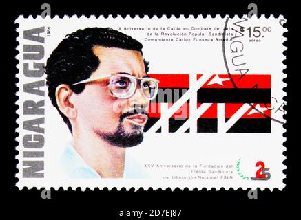 MOSCOW, RUSSIA - NOVEMBER 26, 2017: A stamp printed in Nicaragua shows The 10th Anniversary of the Death of Carlos Fonseca Amador, Founding of the San Stock Photo