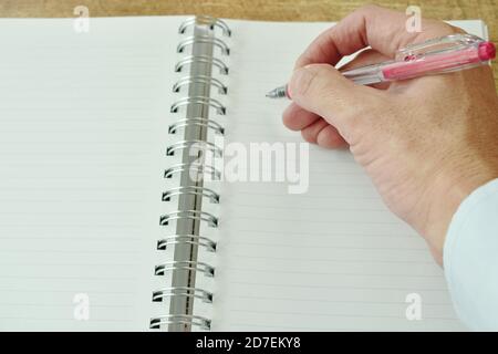 hand writing on white paper book binding Stock Photo