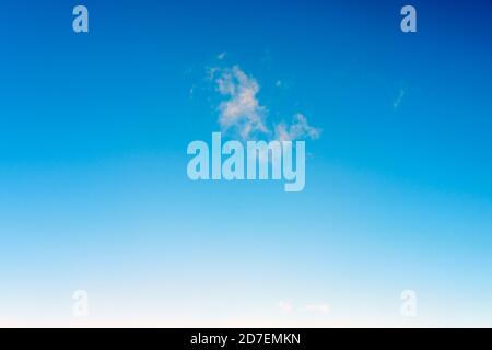 Small cloud in the blue sky, background, copy space for text Stock Photo