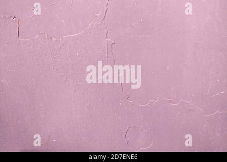 The background of dried paint on the metal surface. Pink texture dirty wall, copy space