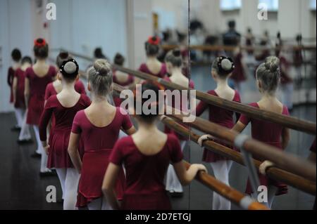 dance school education concept of group of little girls ballerina in russian dancing class during rehearsal before show Stock Photo