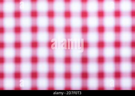 Close up of a blurred red and white cross pattern and texture, as chess table. Red and white chess table. Stock Photo