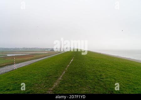 Lighthouse Lange Jaap under a cloudy sky in Den Helder, The Netherlands Stock Photo